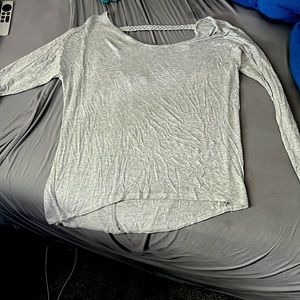 Long sleeve grey shirt with braided band detailing in the back. Size large